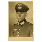Wehrmacht soldier in Waffenrock from 130 Infantry regiment studio portrait